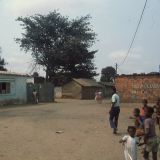 Nao Lixoo (No Garbage) written on brick wall in background